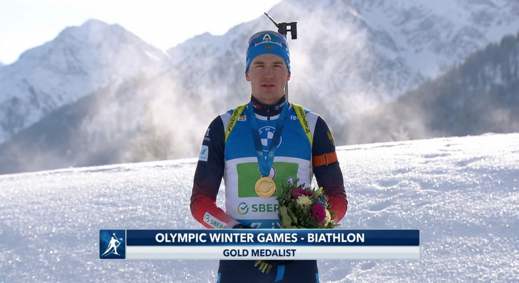 Сгенерировать фото или селфи в тематике "Я на пьедестале с золотой медалью по биатлону"