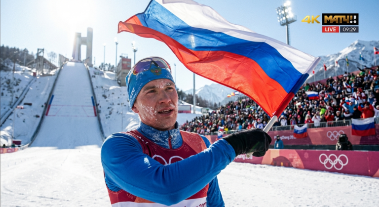 Сгенерировать фото или селфи в тематике "Я — спортсмен с флагом после лыжного двоеборья"